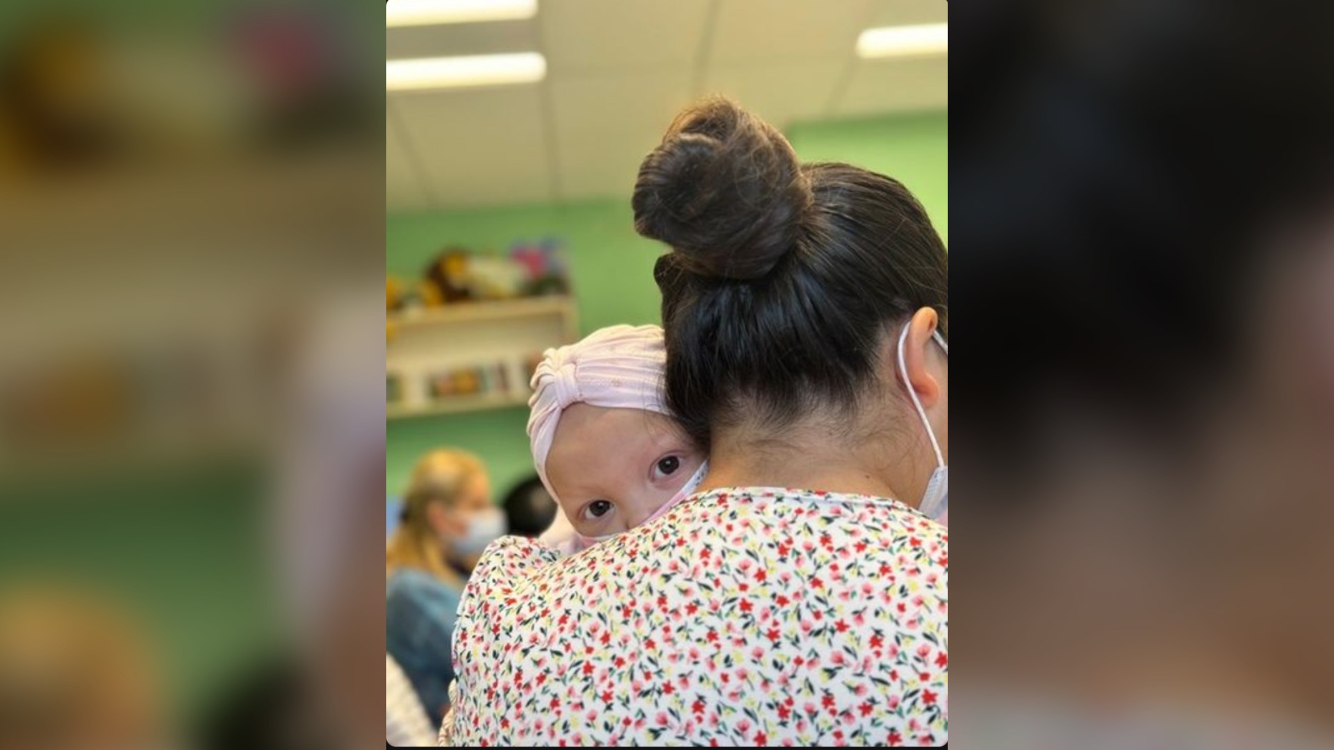 Mother holding child at APCAO pediatric onco-hematology department